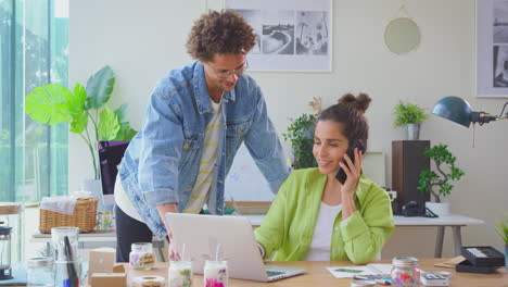 Couple-Running-Online-Business-Making-Candles-At-Home-Celebrating-Order-With-High-Five-And-Hug