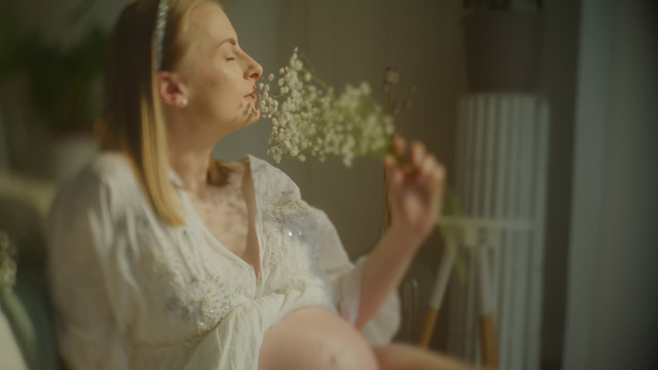 Pregnant Woman with Baby's Breath Bouque