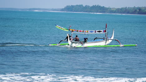 man having fun on flyboard while traditional balinese