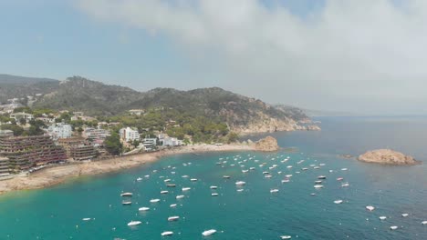 Beautiful-rocky-coast-with-beach-and-boats