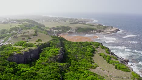 dynamic aerial flyover of coastal houses, windy day