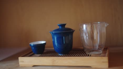 gaiwan for tea along with a pourer and a cup