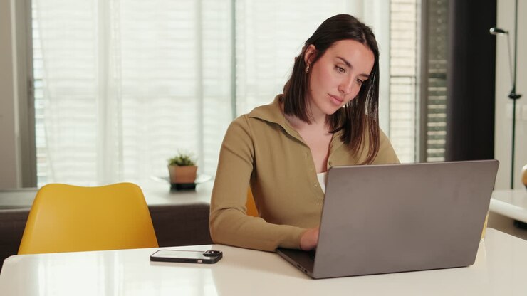 Side view of the Woman Working Remotely From Home Office
