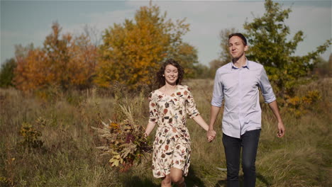 happy duo holding close outdoors