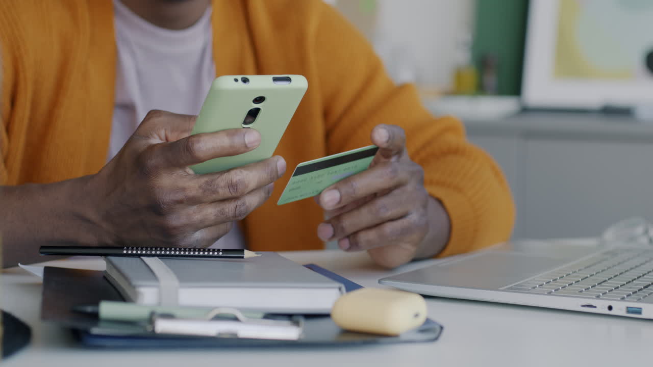 Man making online payment with credit card and smartphone