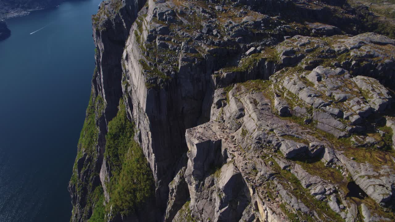 Gorgeous aerial angle on Preikestolen Pulpit Rock plateau in Norway with Lysefjord and high cliffs.