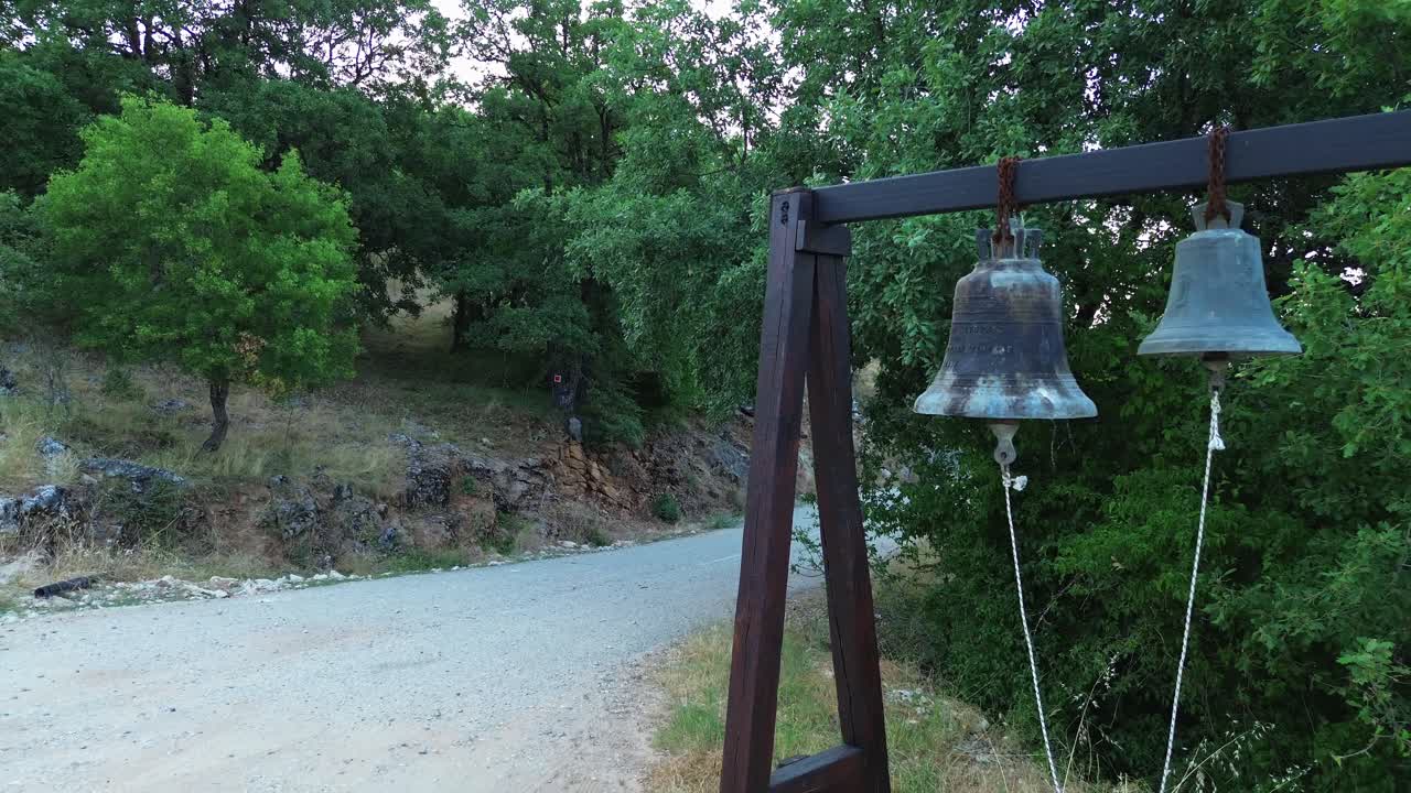 Orthodox Christian church bells on wood frame Greece countryside rural faith religion