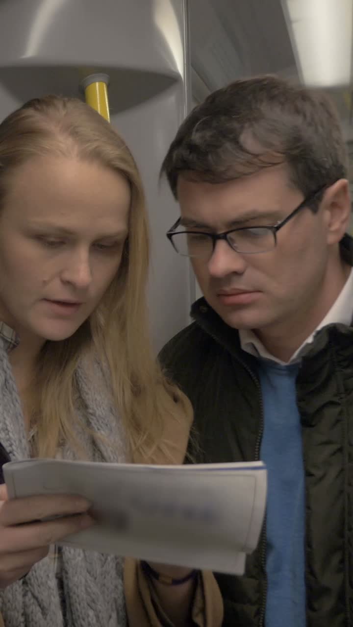 People Reading on a Train