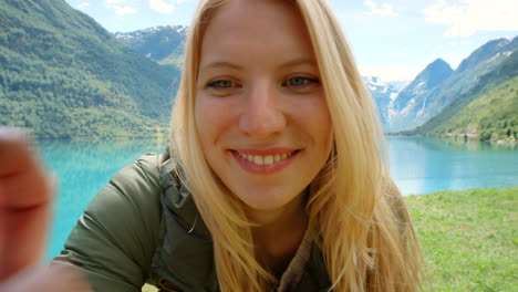 happy woman enjoying a scenic fjord view