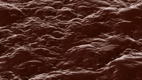 chocolate color lumpy liquid surface waves background