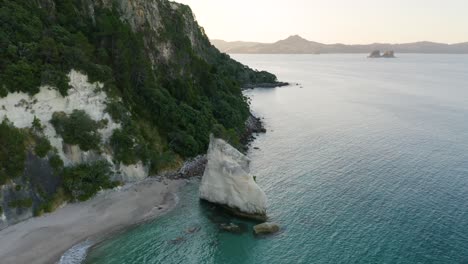 Circling-Pan-Down-shot-of-Te-Hoho-Rock-at-New-Zealand's-Cathedral-Cove