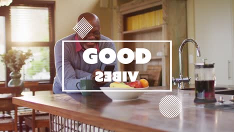 animation of good vibes text over smiling senior african american man using smartphone