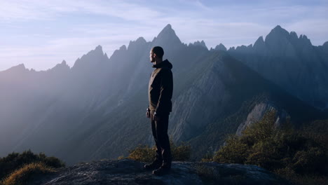 man admiring mountain landscape