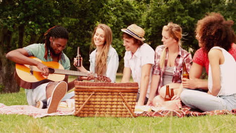 in slow motion happy friends in the park having picnic