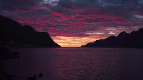 dramatic sunset over mountains near fjordgard fishing village in senja, troms og finnmark county, norway