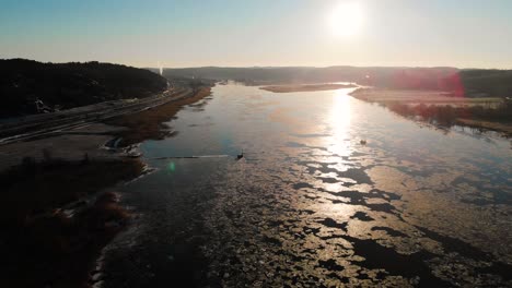 aerial shot of beautiful ice covered lake landscape at sunrise, travel destination in sweden