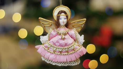 christmas toy angel shakes at background bokeh