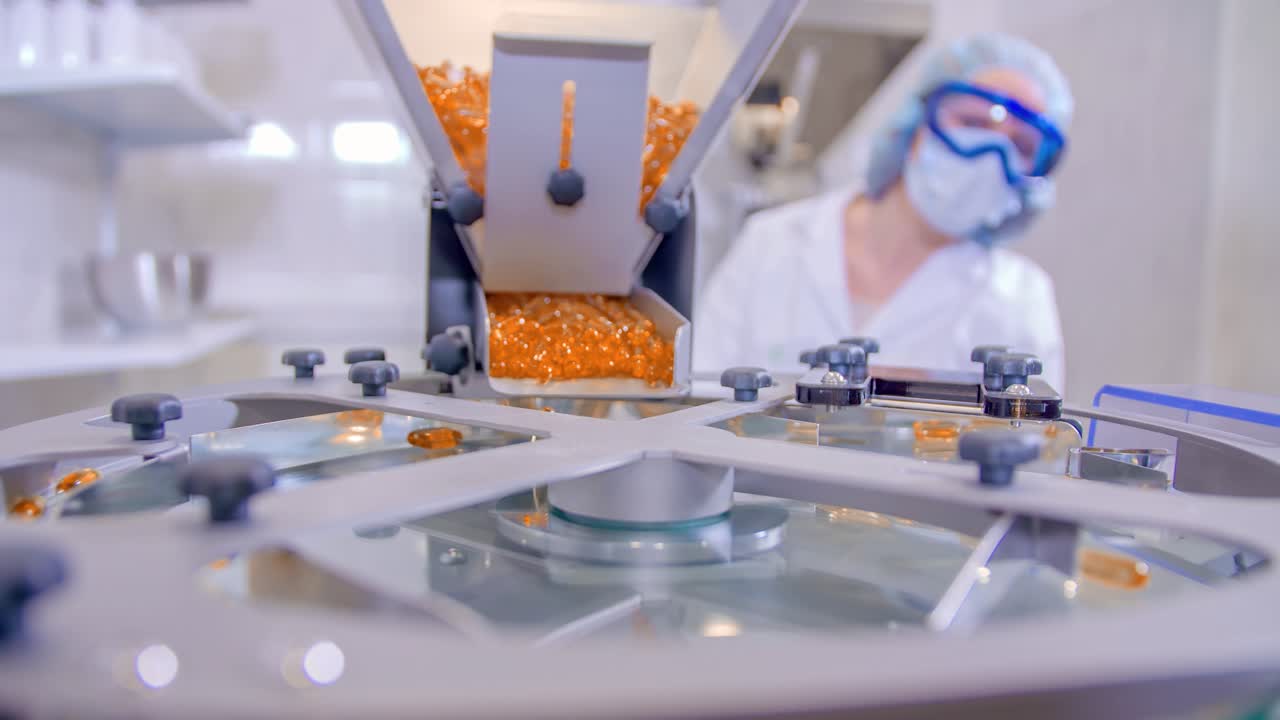 Slow motion shot of a woman working with pills on a pharmaceutical lab