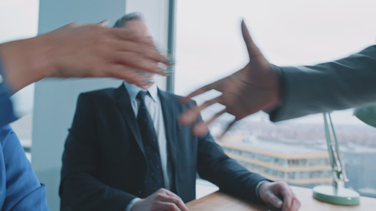 Businesspeople shaking hands in an office