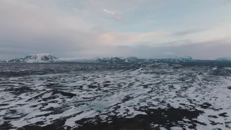 bleak, barren landscape of iceland during snowy winters, aerial