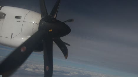 close up: small plane propeller spinning on airplane flight