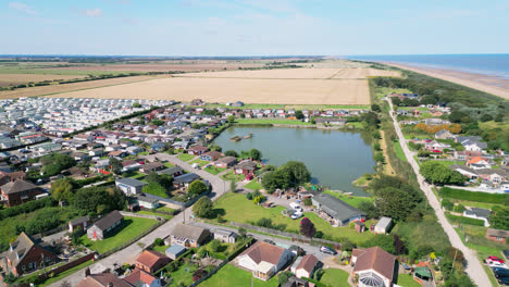 Video-from-above-showcases-the-beauty-of-Anderby-Creek,-a-peaceful-and-picturesque-beach-on-the-Lincolnshire-coast-in-the-town-of-Anderby