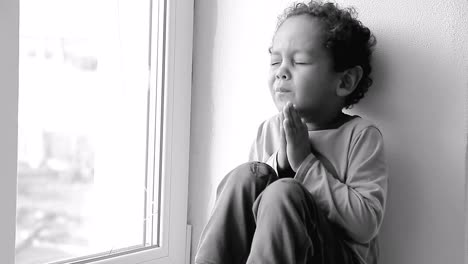 little boy praying to god with hands together on white background with people stock video stock footage