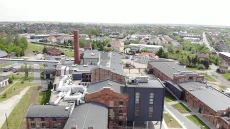 aerial slow orbit shot of the arche hotel żnin inside old sugar factory in poland