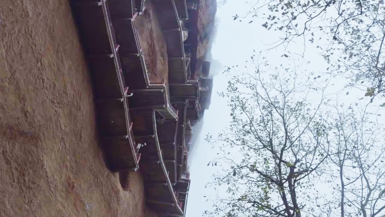 A View Of Cantilevered Walkways At The Maijishan Grottoes In Tianshui, Gansu Province, China. Low Angle Shot