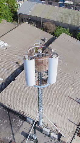 monopole cell phone tower hidden antenna on a building in a small industrial area for mobile devices - antenna emitting non-unisang radioactivity near a residential area - vertical video