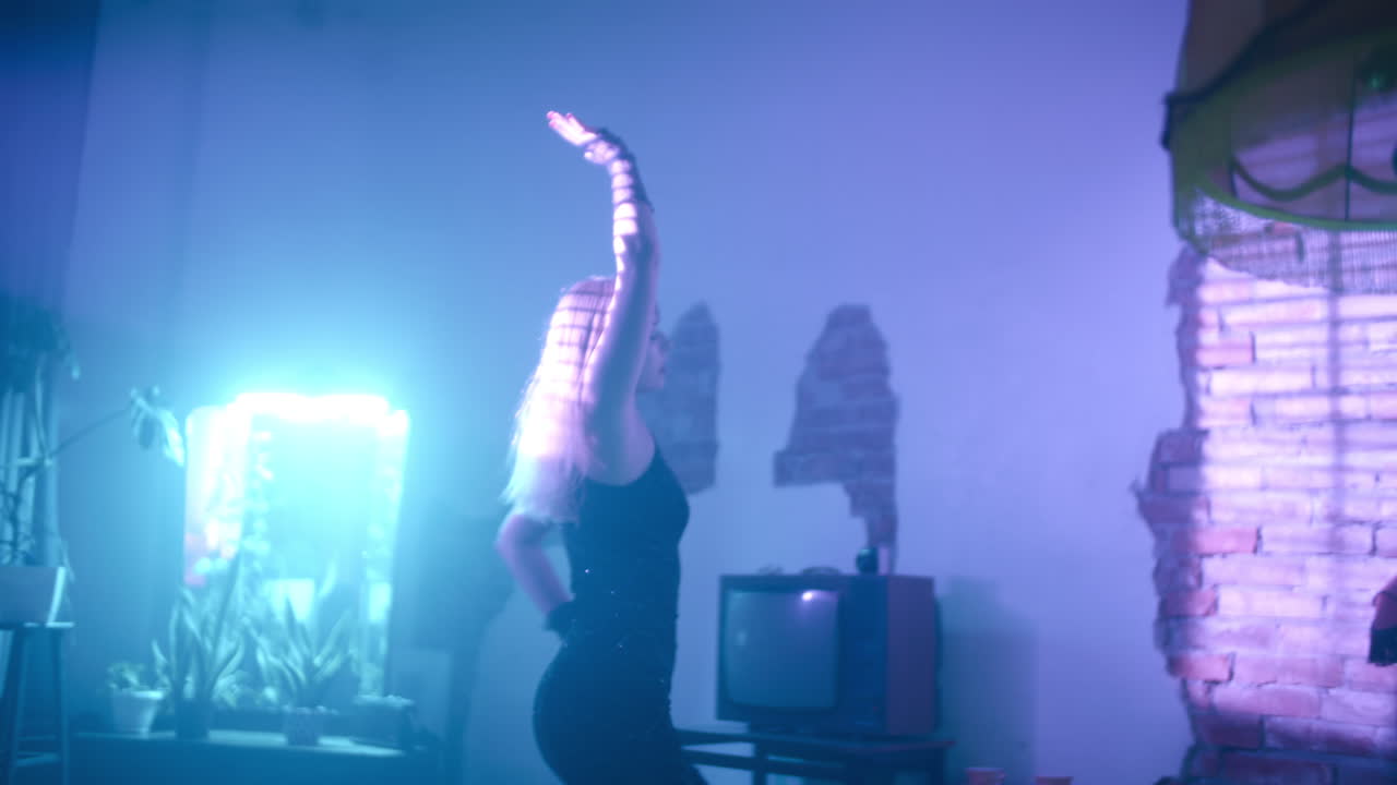 Woman Dancing in Retro Neon Lit Room