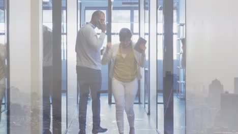 happy asian businesswoman celebrating in office corridor after meeting, over cityscape