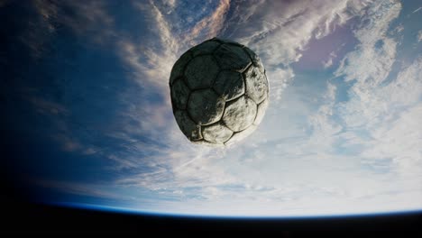 old soccer ball in space on earth orbit