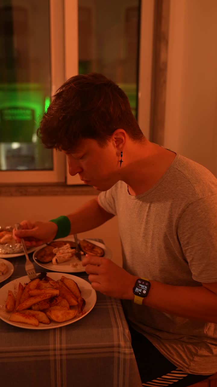 Man Eating Dinner at Home