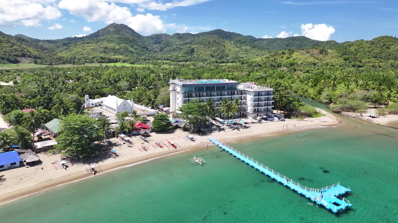 Remote village on Busuanga Island with a clear view of a sandy beach and hotel