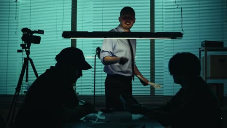 medium silhouette video of a offender perpetrator or prisoner sitting in the room the detective medium silhouette video of a offender perpetrator or prisoner sitting in the room the detective brings him a cup of water and begins the interrogation process true crime documentary creative