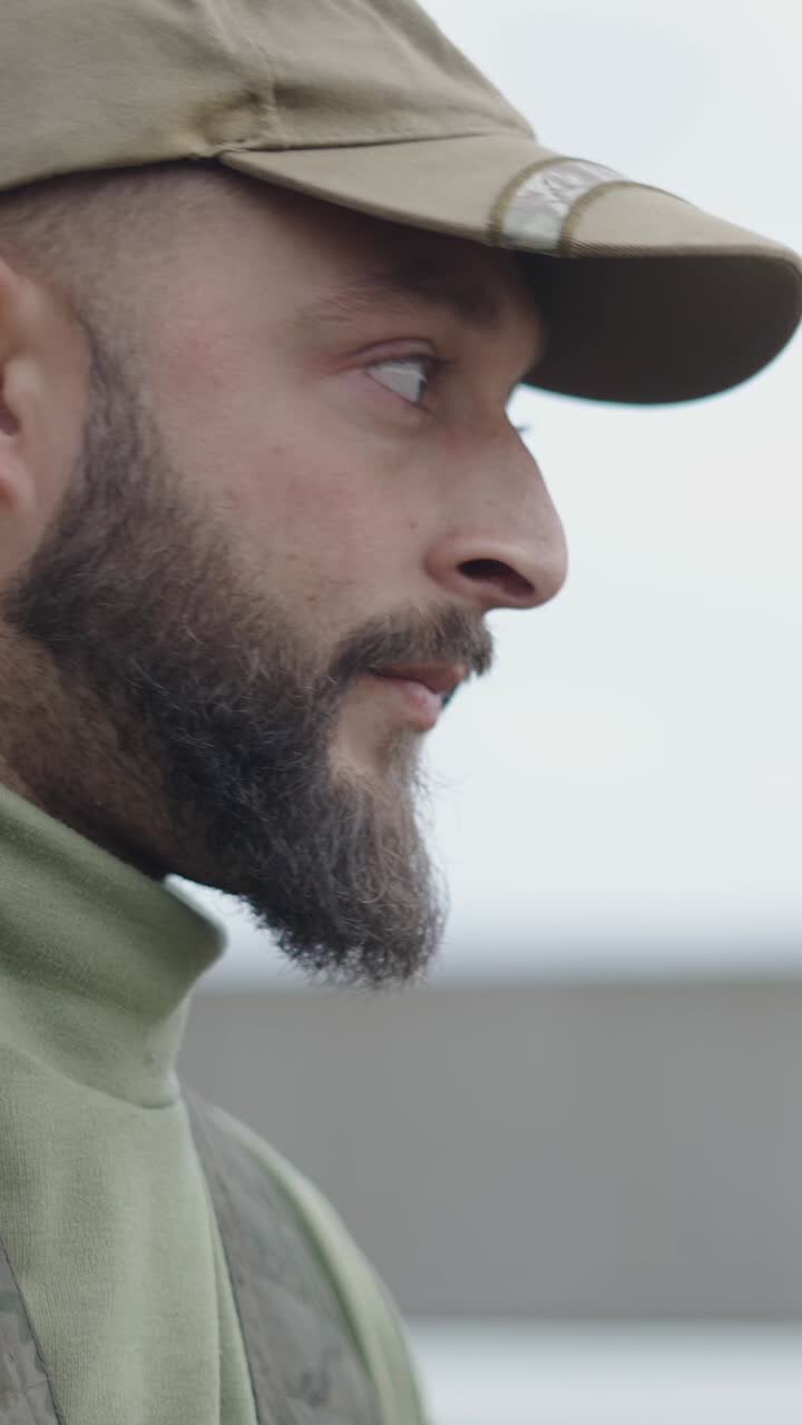 A man in military uniform with a beard