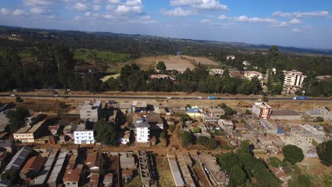 Aerial-Shot-Of-Beautiful-Residential-Area-With-Green-Nature-Near-Highway