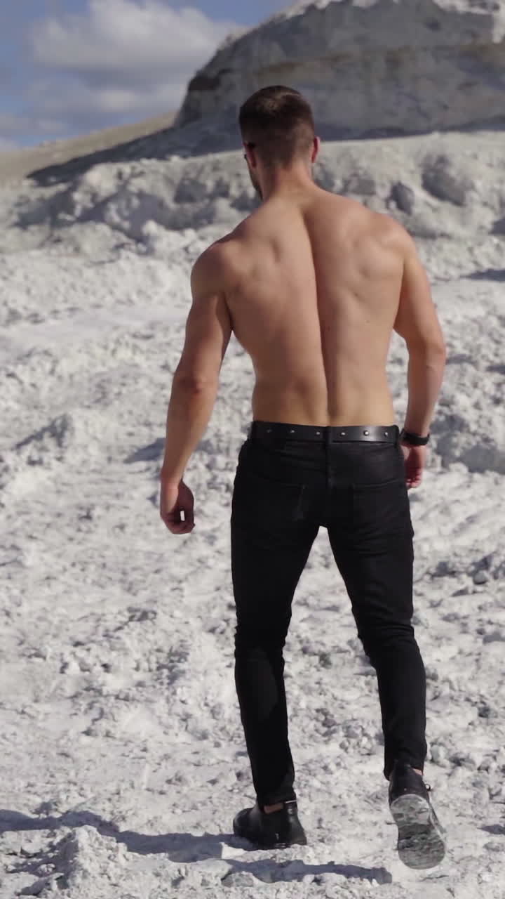 Handsome shirtless muscular young man. Athletic inflated muscular man with nude torso