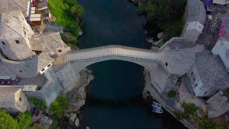 aerial drone video of iconic mostar bridge with no people in on very quiet summer's morning - mostar, bosnia and herzegovina