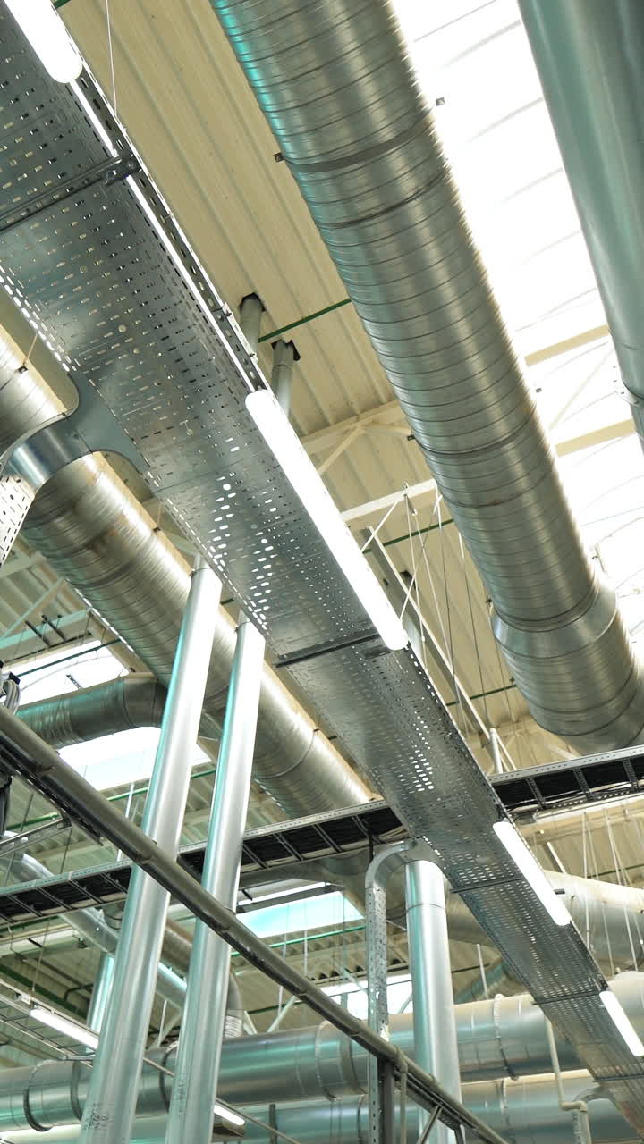 project of the pipe ventilation system at the wood-processing plant. Modern floorboard manufacturing plant. Vertical video