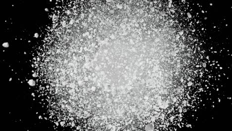 super cámara lenta de la explosión de polvo de color aislado en el fondo oscuro.