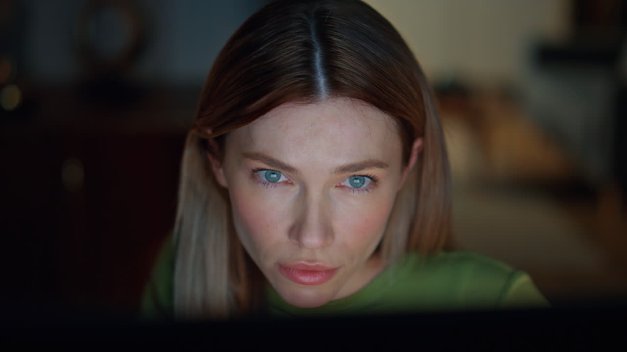 Night worker looking computer having overtime work in apartment close up.