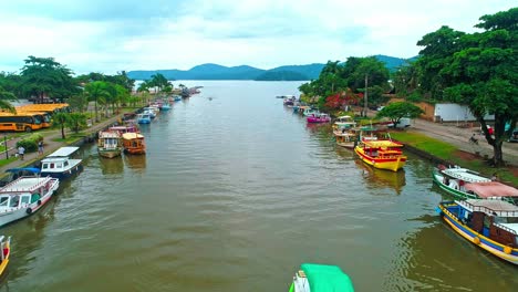 Flying-low-over-the-canal-in-Paratay,-Brazil