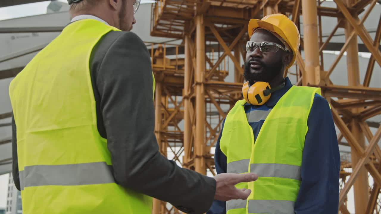 Site Supervisor and Foreman Shaking Hands