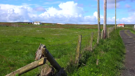 beautiful thunderhead clouds form behind remote farms near john o'groats