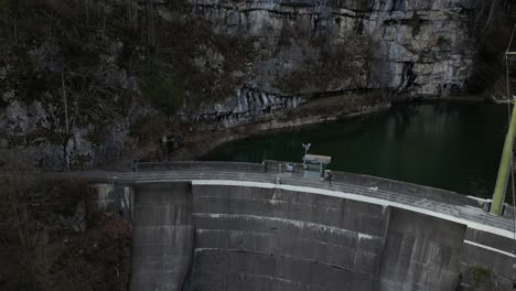 high angle view of a dam with a man playing with his pet dog