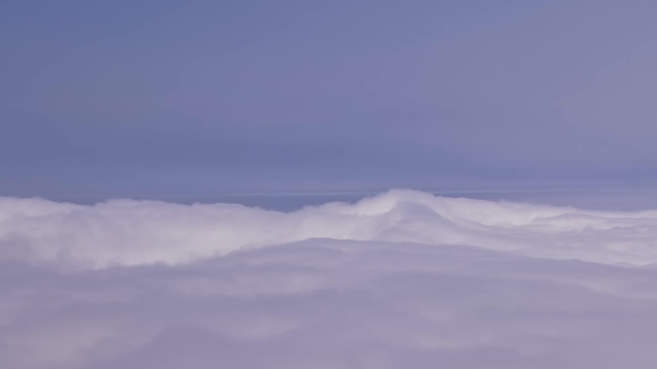 Captivating aerial view of clouds above Madeira, Portugal captured by drone