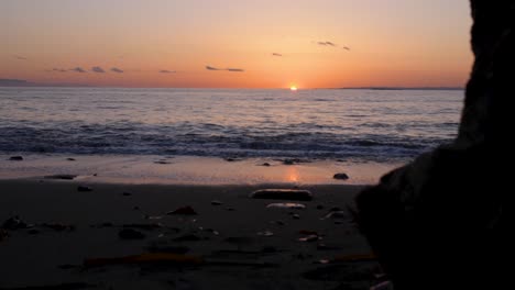 panning reveals ocean view as the sun is at the horizon