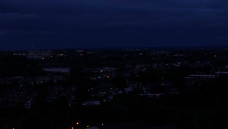 night darkness illuminated by the lights of small village of houses